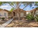 Charming single-story home featuring a cozy front porch and mature landscaping at 875 S Nebraska St # 69, Chandler, AZ 85225