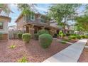 Attractive home exterior with neat landscaping, healthy plants, and a walkway at 999 S Sabino Dr, Gilbert, AZ 85296