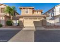 Charming two-story home with a well-maintained front yard, a two car garage, and sidewalk appeal at 999 S Sabino Dr, Gilbert, AZ 85296