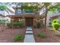 Charming home with a well-maintained front yard and a concrete walkway leading to the entrance at 999 S Sabino Dr, Gilbert, AZ 85296