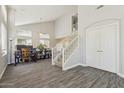 Open-concept foyer featuring vinyl plank flooring and stairs to the second floor at 1014 S Porter St, Gilbert, AZ 85296