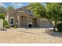 Charming two-story home featuring a well-manicured front yard and inviting entryway at 1014 S Porter St, Gilbert, AZ 85296
