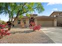 Charming single-Gathering home with a well-manicured desert landscape and a two-car garage at 10239 E Salt Bush Dr, Scottsdale, AZ 85255