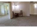 Cozy living area with comfortable seating, neutral carpet and natural lighting at 10428 W Camelot Cir, Sun City, AZ 85351