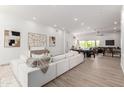 Bright and airy living room with a modern sofa, stylish decor, and a seamless connection to the outdoors at 11662 E Parkview Ln, Scottsdale, AZ 85255