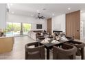 Open-concept living area showcasing a stylish fireplace, modern furnishings, and seamless indoor-outdoor flow at 11662 E Parkview Ln, Scottsdale, AZ 85255