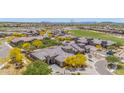 An aerial view shows this beautiful desert home is part of a vibrant community with golf course and lush landscape at 12325 S 179Th S Ave # 0, Goodyear, AZ 85338