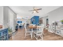 Dining area with a wooden table, seating for four, and stylish decor at 1250 N Abbey Ln # 275, Chandler, AZ 85226