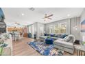 Cozy living room with a large sectional sofa, wood floors, and abundant natural light at 1250 N Abbey Ln # 275, Chandler, AZ 85226