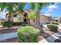 Charming two-story home with a two car garage and landscaped front yard at 13965 N 135Th Dr, Surprise, AZ 85379