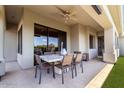 Covered patio with ceiling fan and outdoor dining area is perfect for entertaining guests at 16540 E El Lago Blvd # 2, Fountain Hills, AZ 85268