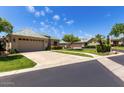 Well-maintained neighborhood with manicured lawns and charming single-story homes with tile roofs at 16540 E El Lago Blvd # 2, Fountain Hills, AZ 85268