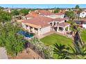 This aerial shot showcases a well-maintained yard and patio with a private pool at 2111 E Azalea Dr, Chandler, AZ 85286