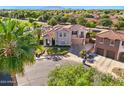 An aerial view of a home with mature trees and manicured landscaping at 2111 E Azalea Dr, Chandler, AZ 85286