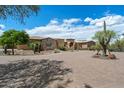 Beautiful home with a circular driveway and desert landscaping at 22610 N 80Th Pl, Scottsdale, AZ 85255