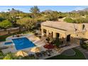Aerial view of the backyard pool, spa, outdoor seating, landscaping, and covered patio at 22610 N 80Th Pl, Scottsdale, AZ 85255
