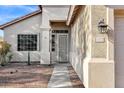 Inviting front entrance with security screen door and well-manicured landscaping at 2272 W Jasper Butte Dr, Queen Creek, AZ 85144