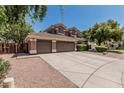 Charming two-story home with a three-car garage and well-maintained landscaping at 30 W Sheffield Ave, Gilbert, AZ 85233