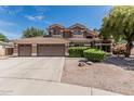 Charming two-story home with a three-car garage and well-maintained landscaping at 30 W Sheffield Ave, Gilbert, AZ 85233
