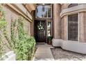 Charming front door featuring decorative wreath, side window, and climbing vines at 30 W Sheffield Ave, Gilbert, AZ 85233