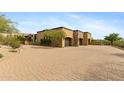 Three-car garage with brick driveway and desert landscaping at 3553 N Crystal Peak Cir, Mesa, AZ 85207