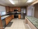 Traditional kitchen featuring stainless steel appliances and a breakfast bar at 4065 E University Dr # 4, Mesa, AZ 85205