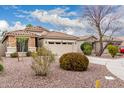 Cozy single-story home featuring desert landscaping and a two-car garage at 4152 S Bandit Ct, Gilbert, AZ 85297