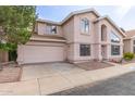 Two-story home with attached garage, well maintained lawn and desert landscaping at 4201 W Renee Dr, Glendale, AZ 85308