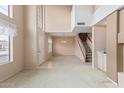 Spacious living room with stairs, natural light, and neutral color palette at 4201 W Renee Dr, Glendale, AZ 85308