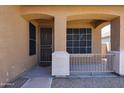 Inviting front porch with neutral paint, security door, and decorative railing for added curb appeal at 45633 W Mountain View Rd, Maricopa, AZ 85139