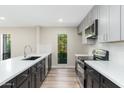 Modern kitchen with stainless steel appliances, sleek countertops, and a beautiful window view at 5221 N 24Th St # 103, Phoenix, AZ 85016