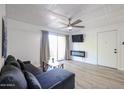 Cozy living room features a modern fireplace and a unique ceiling at 8055 E Thomas Rd # 104, Scottsdale, AZ 85251