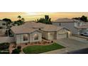 Charming single-story home with a two-car garage, a well-kept lawn, and tasteful landscaping at 854 W Mesquite St, Gilbert, AZ 85233