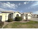 Well-maintained home featuring a two-car garage and lush landscaping, with neatly trimmed bushes at 854 W Mesquite St, Gilbert, AZ 85233