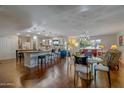 Open-concept living area with a dining area, a large kitchen, and a seamless flow at 17668 N Del Webb Blvd, Sun City, AZ 85373