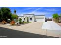 The house features a driveway, white paint, desert landscaping and an attached garage at 1806 W Rosewood Ct, Chandler, AZ 85224