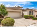 Charming single-story home features low-maintenance landscaping, tile roof, and two car garage at 18131 W Addie Ln, Surprise, AZ 85374