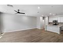 Expansive living room with hardwood floors that opens up to the kitchen at 1823 E Chelsea Ln # 106, Gilbert, AZ 85295