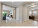 Bright foyer with tile flooring, leading to the living spaces at 18929 W Windsor Blvd, Litchfield Park, AZ 85340