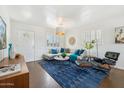 Bright living room featuring a sectional sofa, stylish rug, and modern decor at 2015 W Weldon Ave, Phoenix, AZ 85015