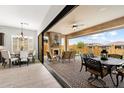 Relaxing outdoor patio featuring a stone fireplace and comfortable seating, perfect for entertaining guests at 2114 N Canelo Hls, Mesa, AZ 85207