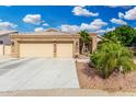 Inviting home with desert landscaping, a spacious driveway, and a convenient two-car garage at 22351 N 67Th Dr, Glendale, AZ 85310