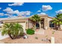 Charming single-story home featuring desert landscaping, a two-car garage, and a welcoming front entrance at 22351 N 67Th Dr, Glendale, AZ 85310
