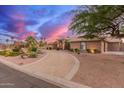 View of circular driveway that leads to an expansive single story home at 3733 E Kachina Dr, Phoenix, AZ 85044