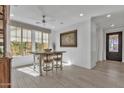 Bright dining area with a large window and modern furnishings at 3750 E Rochelle Cir, Mesa, AZ 85215