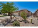 Beautiful single-story home featuring well-kept landscaping and a neutral color palette at 38662 N La Grange Ln, San Tan Valley, AZ 85140
