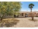 Attractive single-story home featuring desert landscaping, covered entrance and convenient carport at 5159 W Vernon Ave, Phoenix, AZ 85035