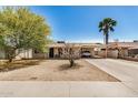 Inviting single-story home with a low maintenance desert landscaped front yard and covered parking at 5159 W Vernon Ave, Phoenix, AZ 85035