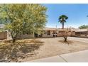 Beautiful single-story home with desert landscape, welcoming porch, and attached carport at 5159 W Vernon Ave, Phoenix, AZ 85035