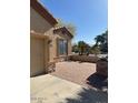 Home with paver patio and desert landscaping, stone veneer accents, and neutral-colored siding at 840 W Crooked Stick Dr, Casa Grande, AZ 85122